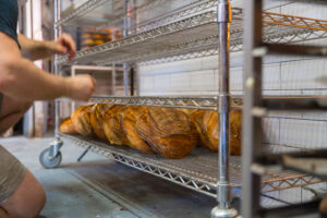 Steel wire shelving used for bread loaves.