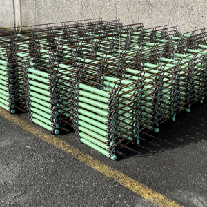 Welded dowel baskets from Oregon Wire, stacked in rows and piles ready for bulk shipping.