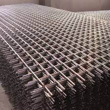 A pile of plain steel mesh sheets made from Oregon Wire's wire materials.