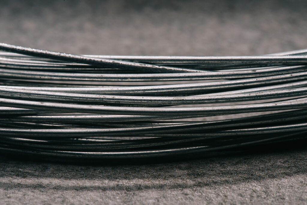 selective focus of grey wires on tabletop