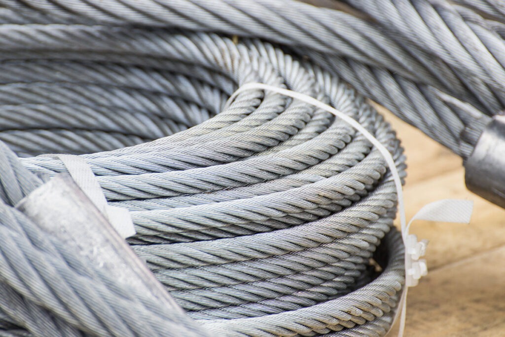 Coiled steel rope as part of vehicle or industrial machine