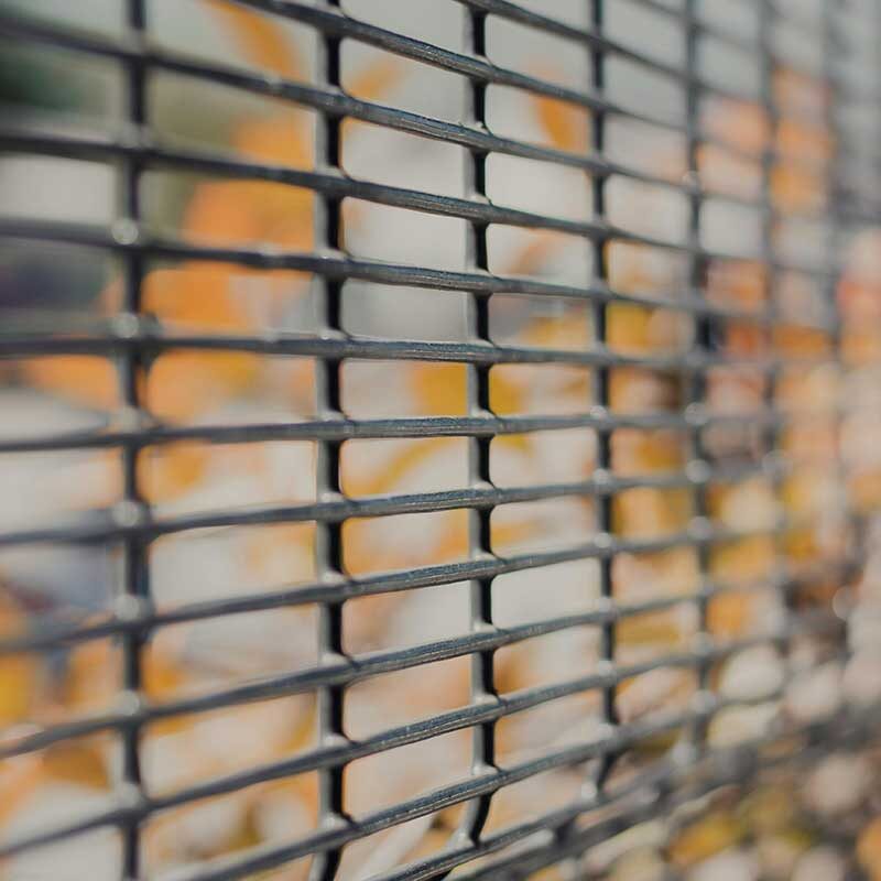 construction-3 A close up with focus on a steel wire gate, made from construction wire materials.